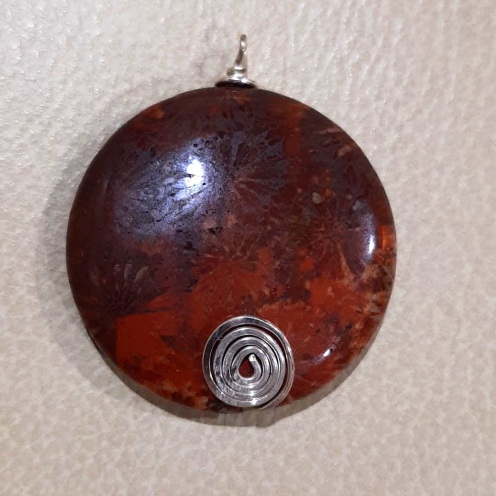 Stone wire wrap pendant, red brown stone with stars